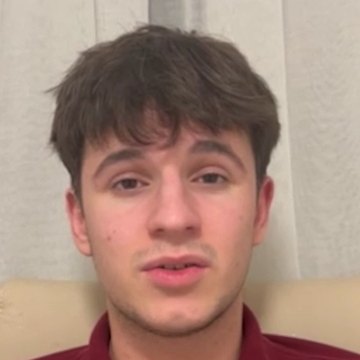 Alexandru R., an IWS graduate, speaking to camera