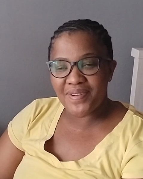 Mpho M. speaking to camera