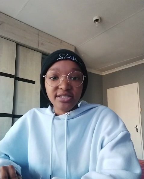 Thato R. speaking to camera