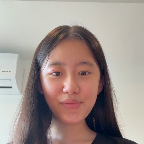 Kei Y., smiling gently at the camera