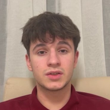 Alexandru R., an IWS alumnus, speaking to the camera
