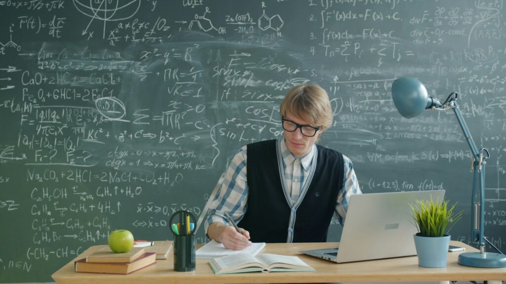 An A-Level student studying online on a laptop — IWS Online School