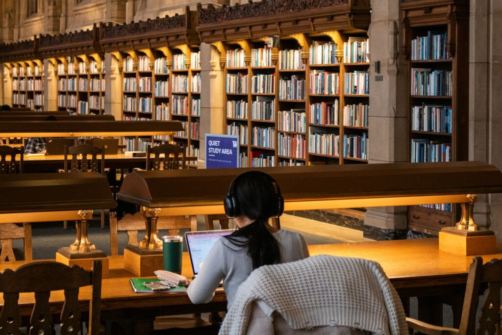 A university foundation student studying in a library — IWS Online School