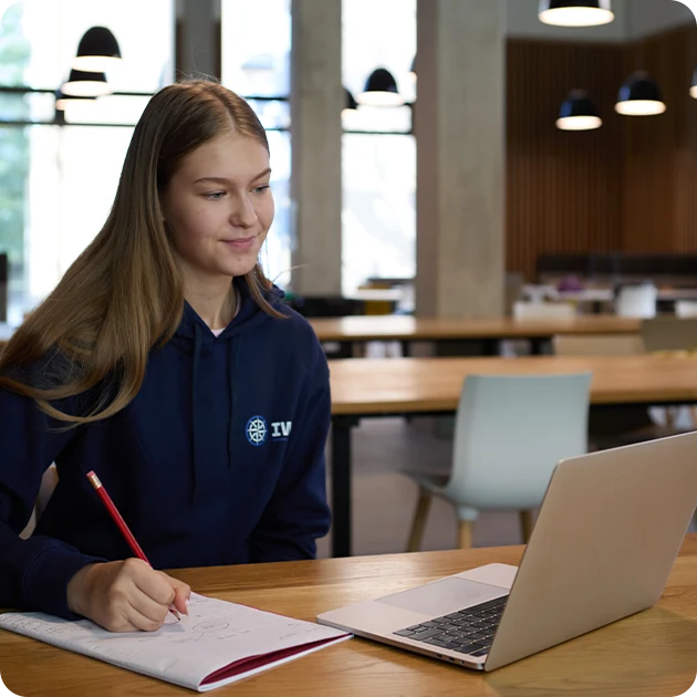 Student learning from home with a qualified teacher at IWS Online School