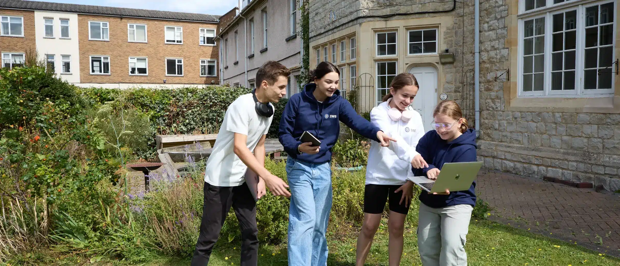 IWS Online School students working together outdoors