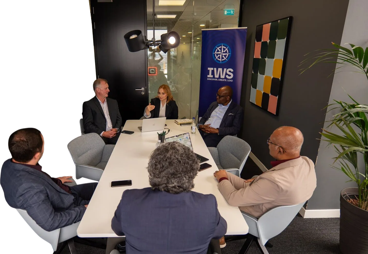 The IWS Online School leadership team and shareholders in a working meeting in London